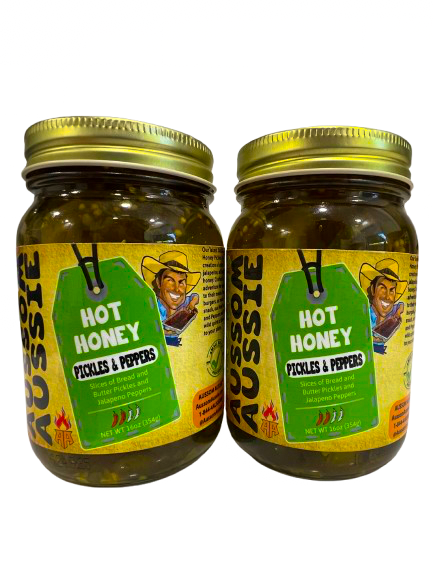 "Introducing our latest Outback Provisions sensation – Hot Honey Pickles and Peppers! This bold and zesty creation is a daring fusion of crisp, tangy pickles and fiery jalapeños, all bathed in sweet and spicy hot honey. The perfect balance of heat and sweet, these pickles and peppers are crafted for those who crave a little adventure in their appetizers or want to add an extra kick to their meals. Perfectly paired with sandwiches, burgers, or even as a standalone snack, our Hot Honey Pickles and Peppers wil